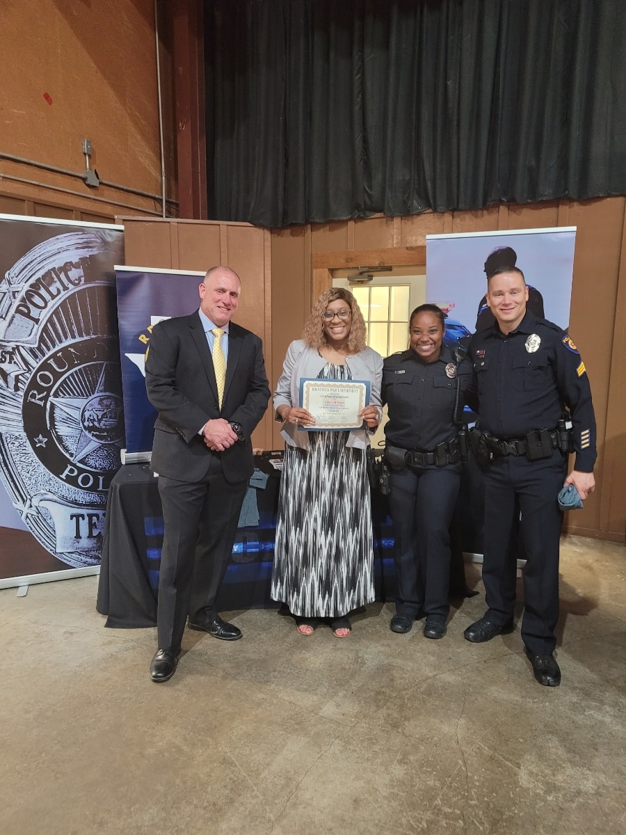 LaDonna Claude receiving recognition at Round Rock Police Department ceremony